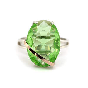 Серебряное кольцо 925 пробы с золотом 375 пробы 4,66 г с салатовым цирконом 3,64 к Серебряное кольцо 925 пробы с золотом 375 пробы 4,66 г с салатовым цирконом 3,64 к