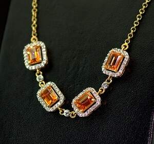 Серебряное колье 925 пробы 8,51 гр. с Кварцами Падпараджа и топазами из США 4,81 карат