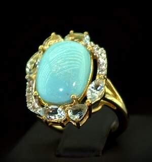 Срібна каблучка 925 проби в позолоті 750 проби 5,11 г з домініканським Ларимаром, швейцарськими Топазами та топазами зі США 8,5 карат Срібна каблучка 925 проби в позолоті 750 проби 5,11 г з домініканським Ларимаром, швейцарськими Топазами та топазами зі США 8,5 карат