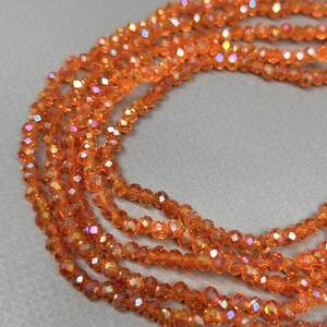 Бусины хрустальные рондель 4х3мм, нить-130 шт, оранжевый прозрачный с АВ Бусины хрустальные рондель 4х3мм, нить-130 шт, оранжевый прозрачный с АВ