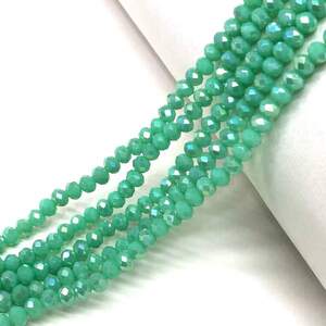 Бусины хрустальные рондель 4х3мм, нить-135 шт, бирюзовый матовый с АВ Бусины хрустальные рондель 4х3мм, нить-135 шт, бирюзовый матовый с АВ