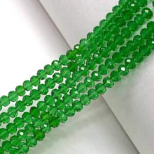 Бусины хрустальные рондель 4х3мм, нить-135 шт, зеленый прозрачный