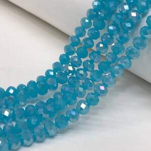 Бусины хрустальные рондель 8х6мм, нить-60 шт, голубой матовый с покрытием АВ Бусины хрустальные рондель 8х6мм, нить-60 шт, голубой матовый с покрытием АВ