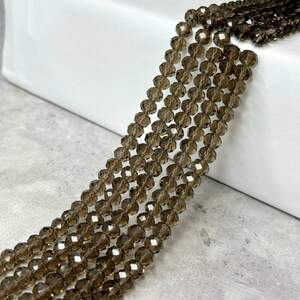 Бусины хрустальные рондель 8х6мм, нить-60 шт, дымчато-серый прозрачный Бусины хрустальные рондель 8х6мм, нить-60 шт, дымчато-серый прозрачный