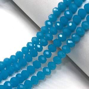 Бусины хрустальные рондель 8х6мм, нить-65 шт, голубой матовый Бусины хрустальные рондель 8х6мм, нить-65 шт, голубой матовый