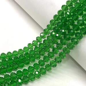 Бусины хрустальные рондель 8х6мм, нить-65 шт, зеленый прозрачный Бусины хрустальные рондель 8х6мм, нить-65 шт, зеленый прозрачный