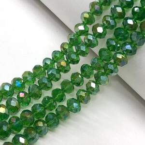 Бусины хрустальные рондель 8х6мм, нить-65 шт, зеленый прозрачный с покрытием АВ Бусины хрустальные рондель 8х6мм, нить-65 шт, зеленый прозрачный с покрытием АВ