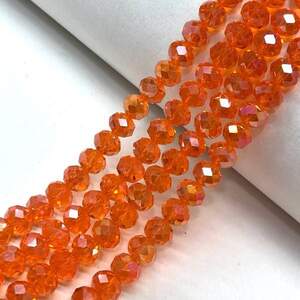 Бусины хрустальные рондель 8х6мм, нить-65 шт, оранжевый прозрачный с покрытием АВ Бусины хрустальные рондель 8х6мм, нить-65 шт, оранжевый прозрачный с покрытием АВ