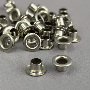 Люверс D-5мм нерж. с пласт. кольцом-никель (100шт) (матр.00254)