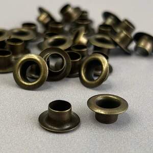 Люверс D-6мм нерж. с пласт. кольцом-антик (100шт) (матр.00255)