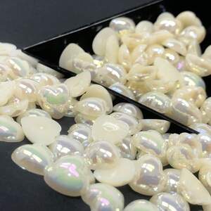 Полубусины сердечки 10мм, #А5 с покрытием АВ - 25шт/уп Полубусины сердечки 10мм, #А5 с покрытием АВ - 25шт/уп