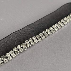 Тесьма-кант 1,7 см односторонняя со стразами - черная Тесьма-кант 1,7 см односторонняя со стразами - черная