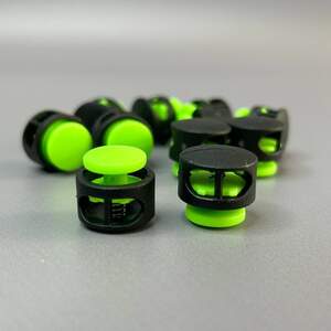 Фиксатор бочонок для шнура пластиковый 16 мм, черный салатовый