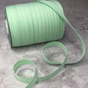 Хлопковая косая бейка,1,5см - 50 полиэстер (100м), цвет 011 Мятный Хлопковая косая бейка,1,5см - 50 полиэстер (100м), цвет 011 Мятный