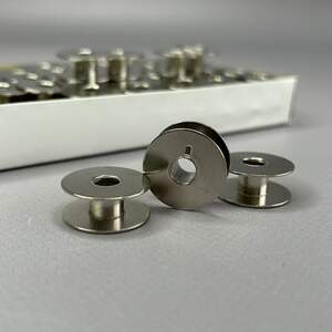 Шпулька 9мм/21мм для швейных машин с углублением, металл Шпулька 9мм/21мм для швейных машин с углублением, металл